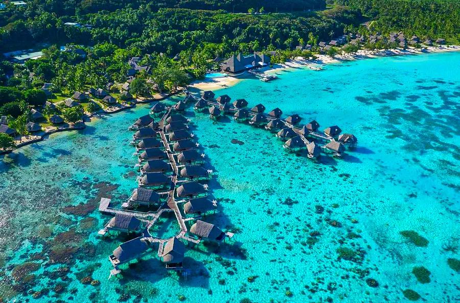 These stunning overwater bungalows in French Polynesia feature glass floors and direct access to a crystal-clear lagoon.