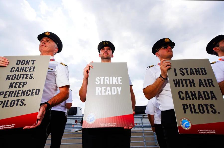 Air Canada prepares for a possible pilots' strike while US airlines negotiate with flight attendants.