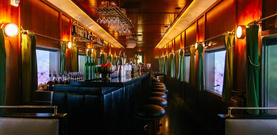 Exploring the Speakeasy-Style Train Bar Nestled in a Desert Strip Mall?