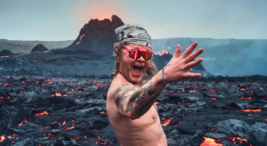 Icelandic man bares all next to erupting volcano