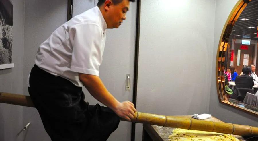 Bouncing with one of Hong Kong's last bamboo noodle artisans