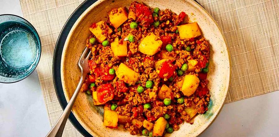 Keema Aloo (Ground Beef and Potatoes) is a delicious and comforting Indian dish featuring ground beef and tender potatoes in a flavorful, spiced curry.