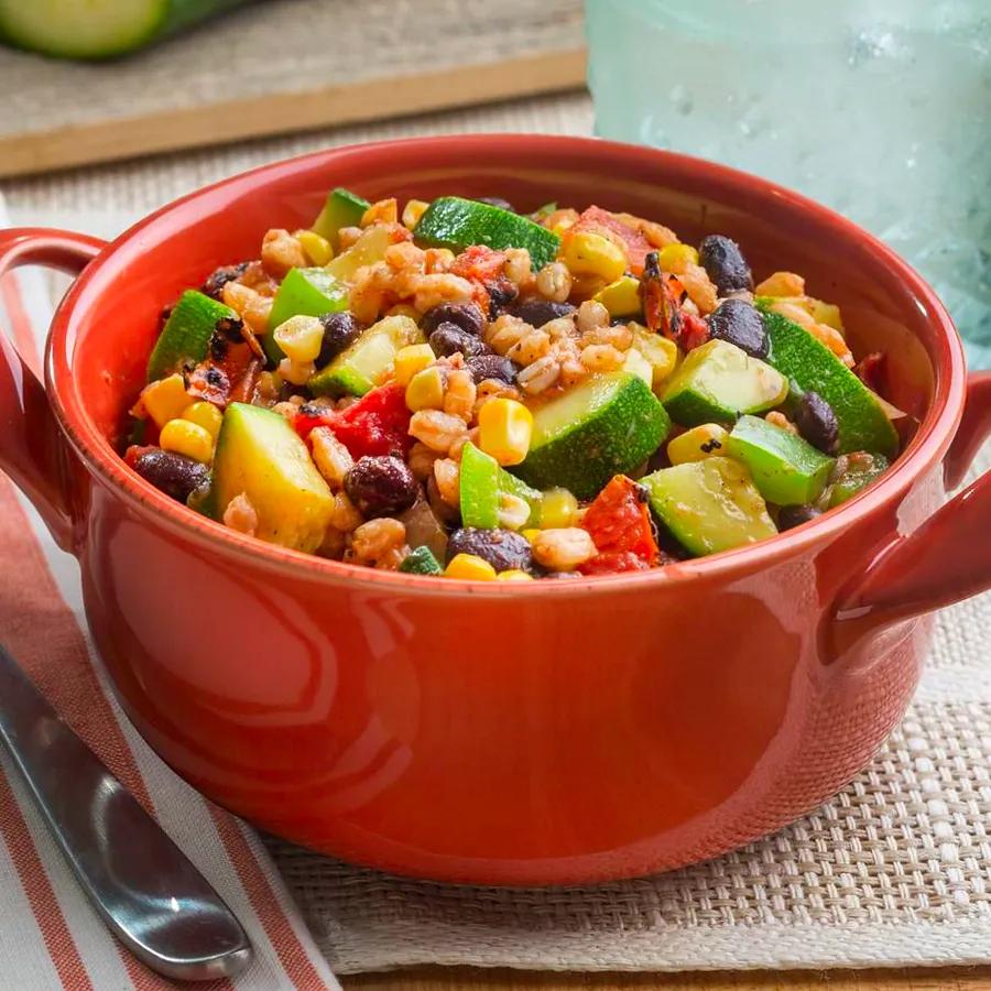 Zucchini, black beans, fire-roasted tomatoes, and farro come together in this vibrant vegetarian skillet dish.