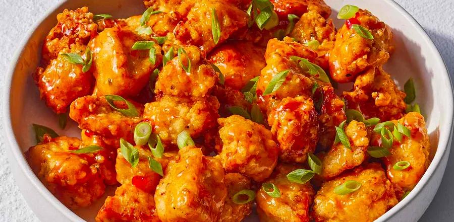 Bang Bang Chicken: A mouthwatering dish featuring crispy, golden-brown chicken pieces coated in a sweet and spicy mayo sauce. Perfect for any occasion.