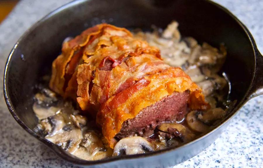 Bacon-Wrapped Venison Tenderloin with Creamy Garlic Sauce