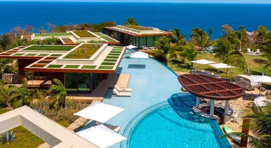 Cover Image for Experience the ultimate luxury on Richard Branson’s Moskito Island with two new exclusive estates available for $19,000 per night | Dinogo