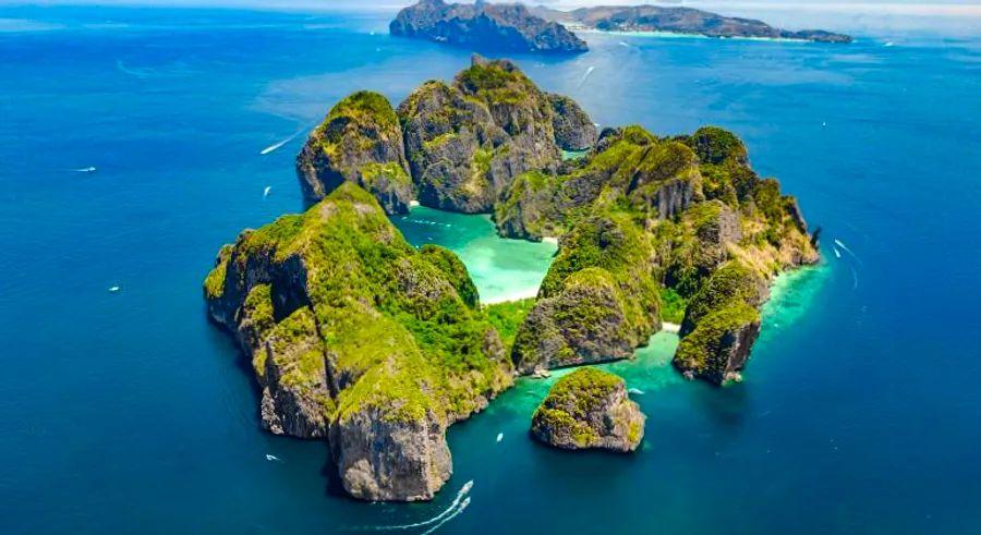Cover Image for Maya Bay, the iconic Thai bay made famous by the movie ‘The Beach’, has officially reopened to the public.