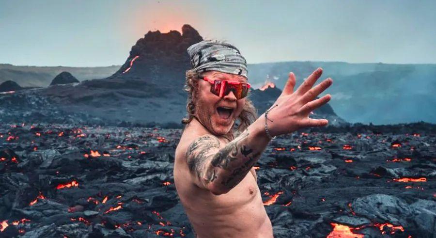Cover Image for Icelandic man bares all next to erupting volcano