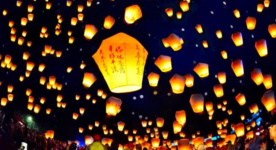 Cover Image for In a village in Taiwan, the night sky is transformed into a glowing canvas of wishes, as thousands of lanterns rise into the air, each carrying a personal message or hope.