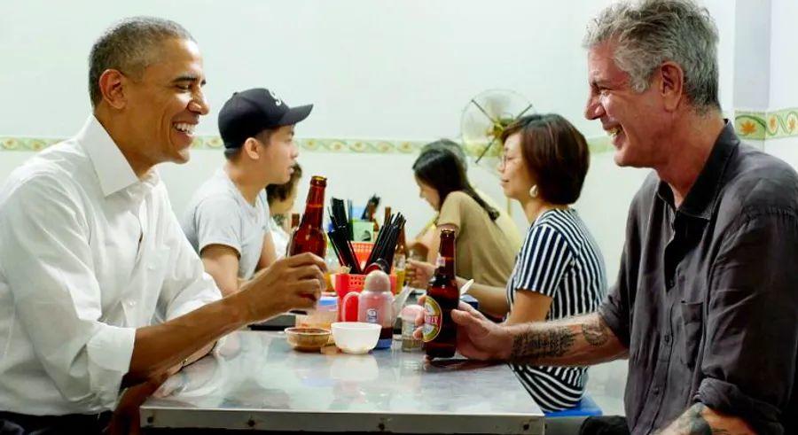 Cover Image for Barack Obama and Anthony Bourdain sit down for a candid conversation in Hanoi, sharing a meal and insights.