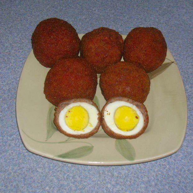 Cover Image for Deliciously crispy and savory Scotch eggs are a perfect combination of hard-boiled eggs wrapped in seasoned sausage and coated in breadcrumbs, deep-fried to golden perfection.