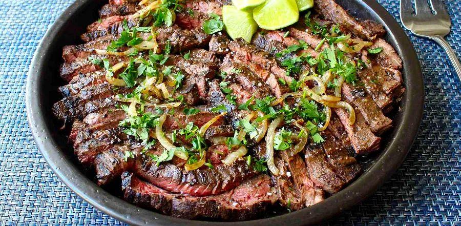 Cover Image for Chef John's Grilled Mojo Beef is a zesty and flavorful dish inspired by Cuban cuisine. The combination of a citrusy marinade and tender beef makes for a mouthwatering grilled meal that’s perfect for any BBQ.