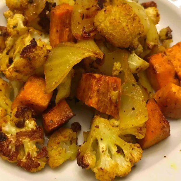 Cover Image for Curry-Spiced Roasted Sweet Potatoes and Cauliflower