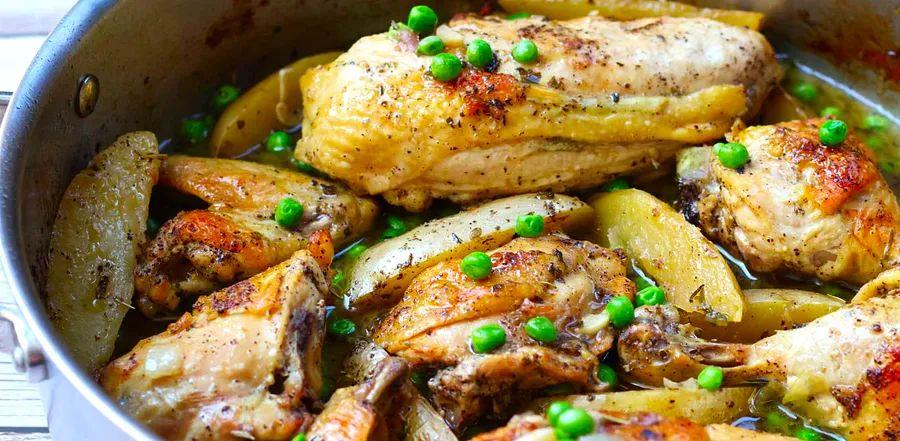 Cover Image for Chicken Vesuvio is a flavorful and hearty dish, showcasing crispy chicken paired with golden potatoes, aromatic garlic, and onions, all simmered in a savory white wine sauce.
